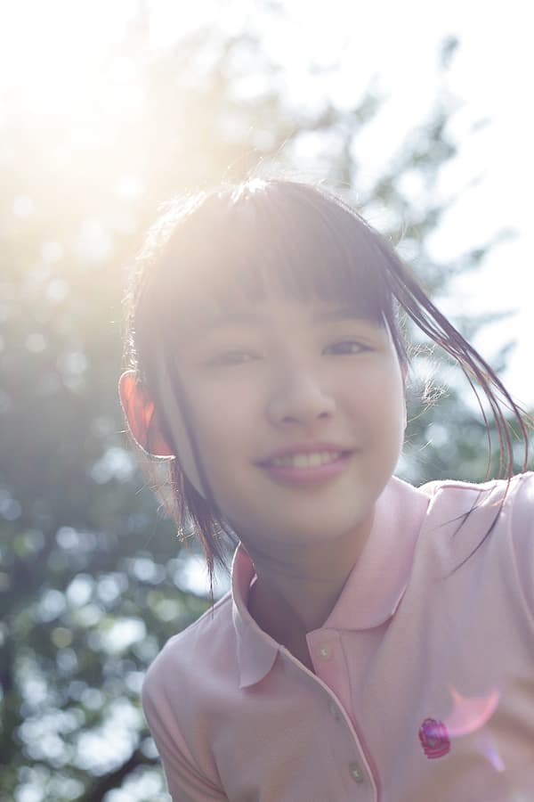 Half-removed cotton sock beside a bare heel, intimate close-up with soft spring lighting